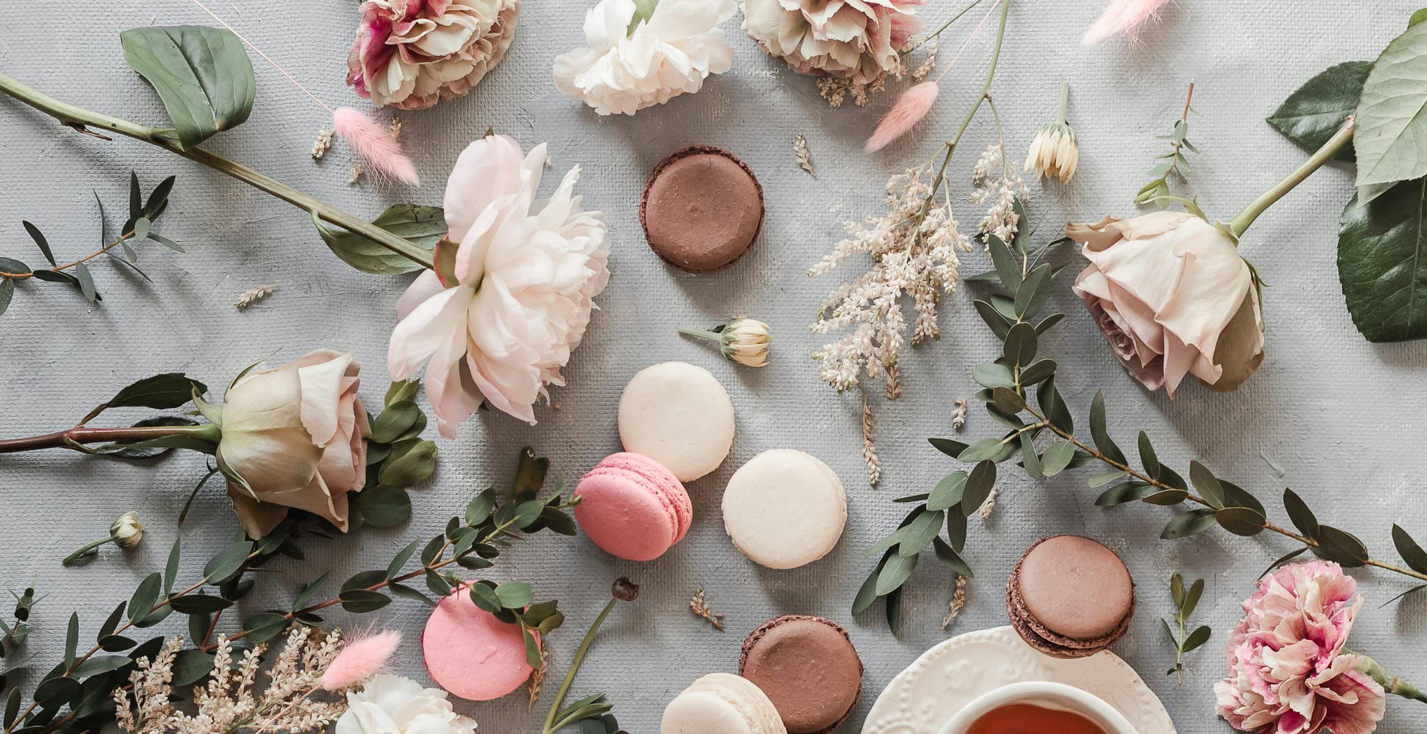 Assorted sweets and confections styled on a surface in soft light